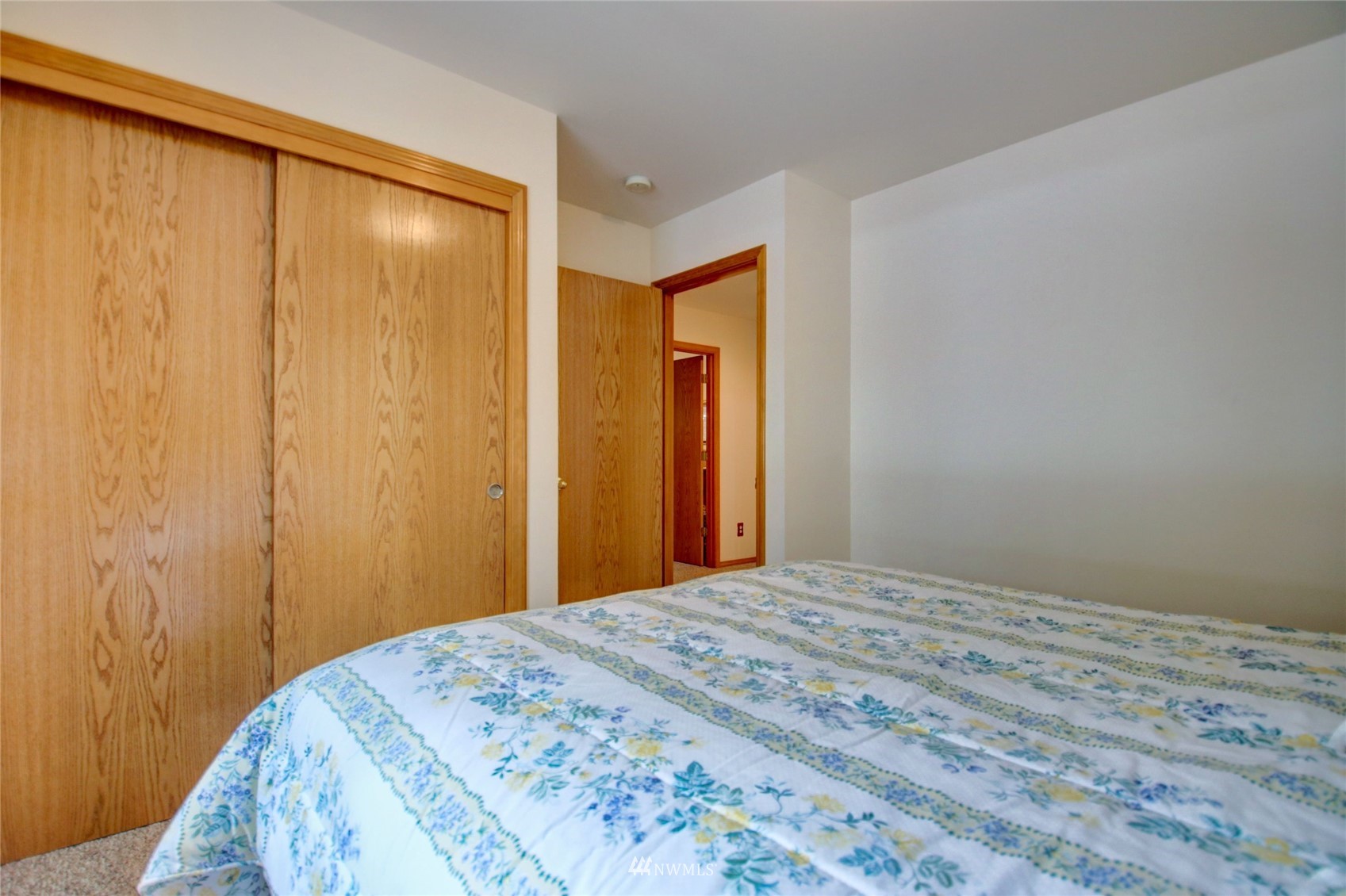 18849 Cascade Ridge Court Mount Vernon, WA 98274 - Photo 22 of 38 a bedroom with a bed and a mirror