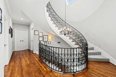 a view of entryway with wooden floor