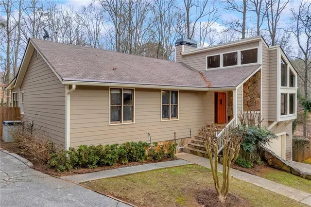 a front view of a house with garden