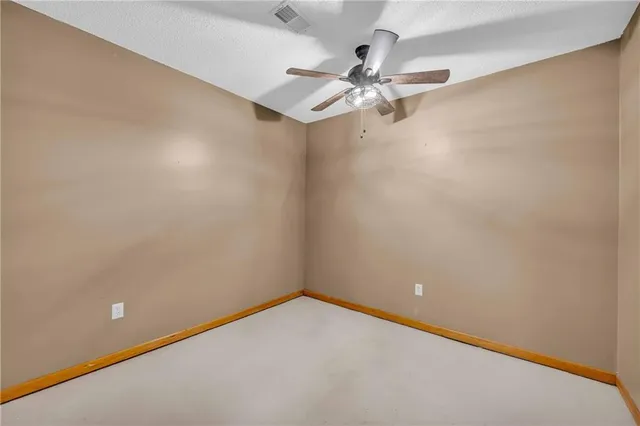 a bathroom with a sink a toilet a mirror and shower