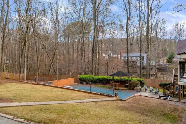 a view of a patio with a chairs and table in a patio
