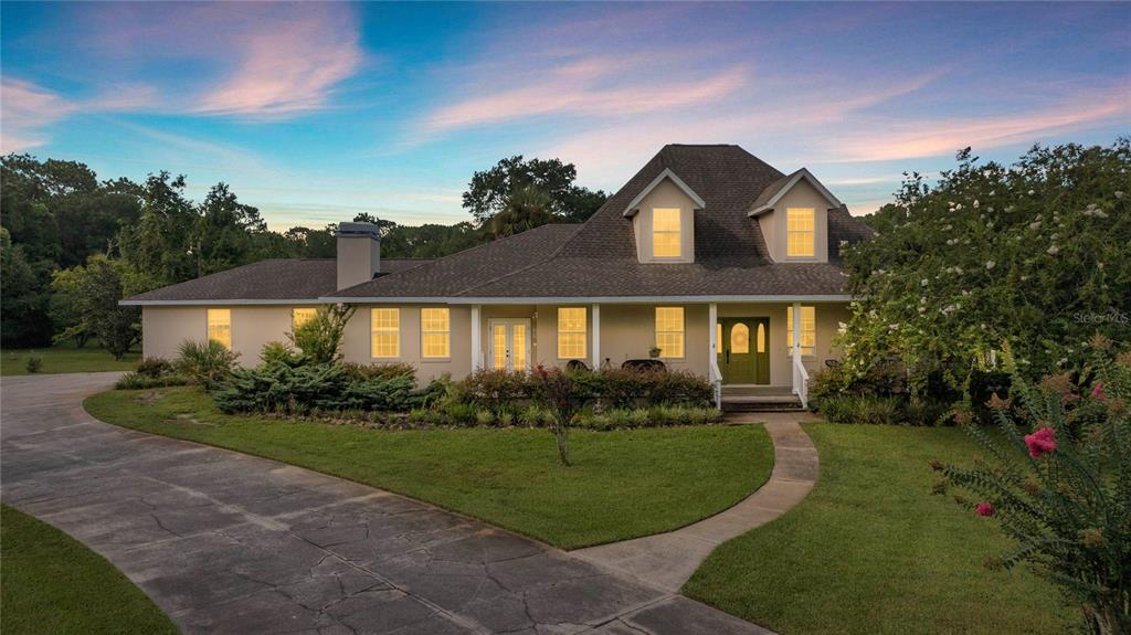 10264 West Springtree Lane Crystal River, FL 34428 - Photo 11 of 87 a front view of a house with a yard