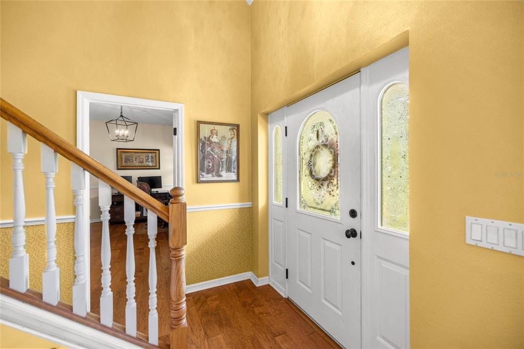 10264 West Springtree Lane Crystal River, FL 34428 - Photo 12 of 87 a view of a hallway with wooden floor and entryway