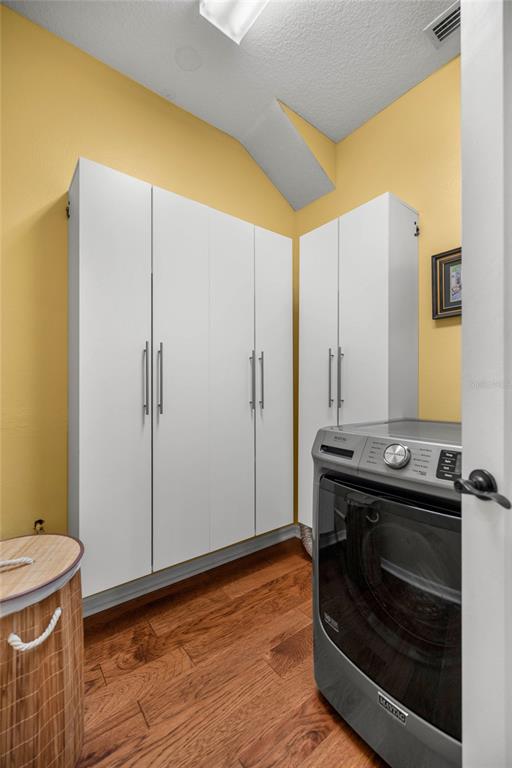 10264 West Springtree Lane Crystal River, FL 34428 - Photo 22 of 87 a view of a hallway with washer and dryer