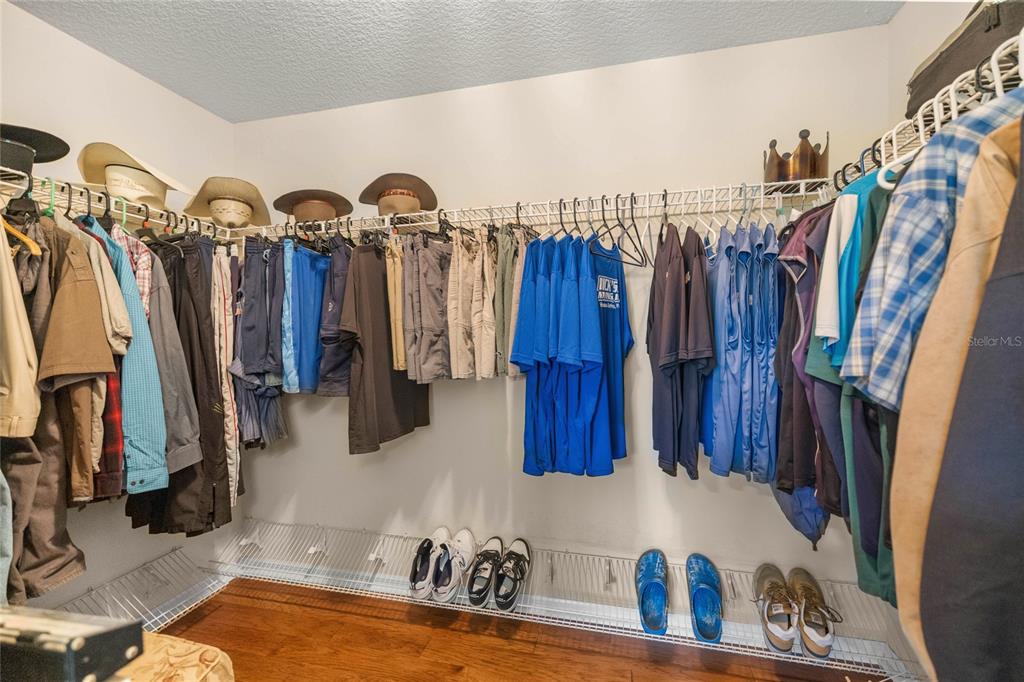 10264 West Springtree Lane Crystal River, FL 34428 - Photo 38 of 87 a view of walk in closet with clothes and shoes