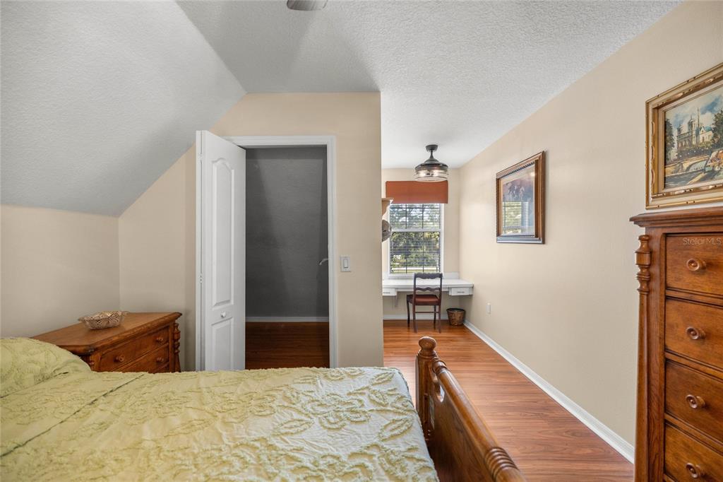 10264 West Springtree Lane Crystal River, FL 34428 - Photo 45 of 87 a bedroom with a bed and a cabinets