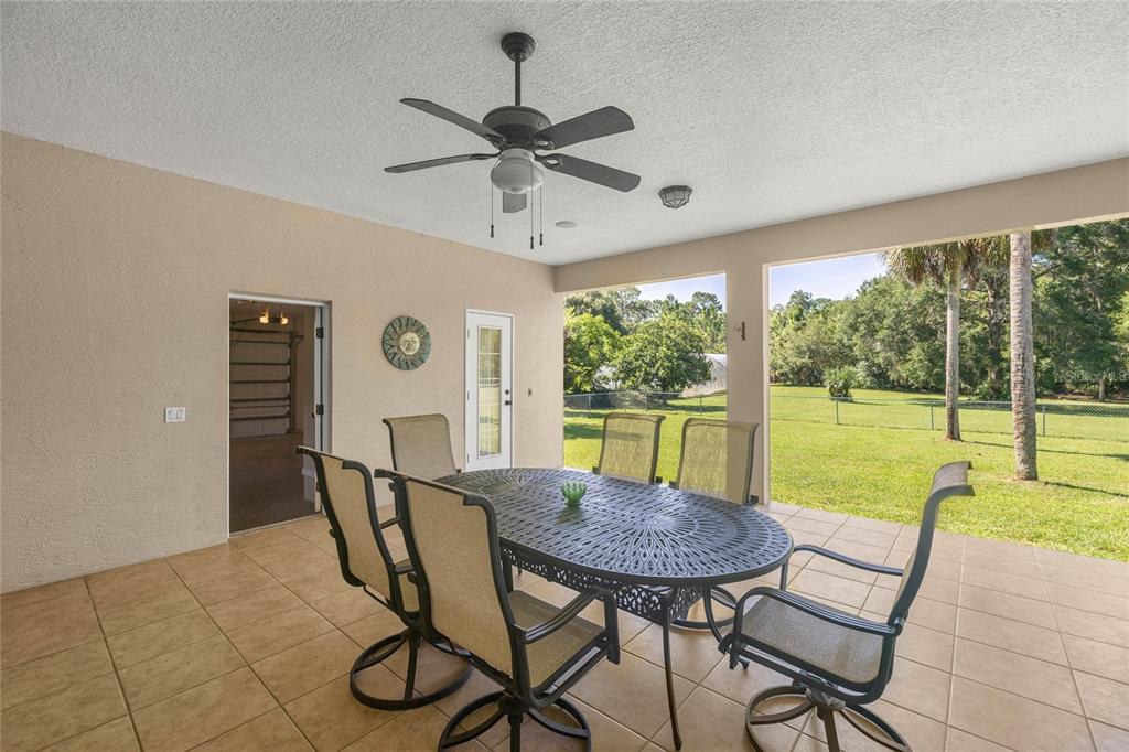 10264 West Springtree Lane Crystal River, FL 34428 - Photo 54 of 87 a view of a dining room with furniture window and outside view