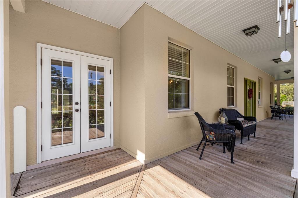 10264 West Springtree Lane Crystal River, FL 34428 - Photo 63 of 87 a view of a house with a chairs and wooden floor