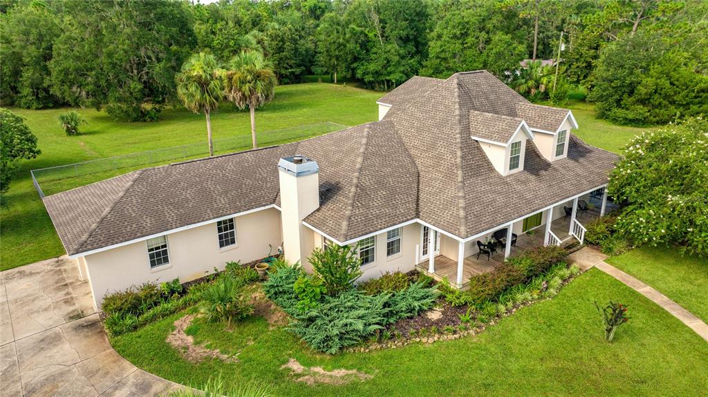 10264 West Springtree Lane Crystal River, FL 34428 - Photo 77 of 87 an aerial view of a house with a yard table and chairs