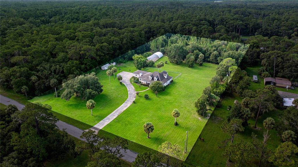 10264 West Springtree Lane Crystal River, FL 34428 - Photo 80 of 87 an aerial view of a golf course with a swimming pool