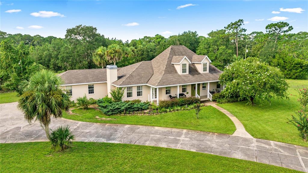 10264 West Springtree Lane Crystal River, FL 34428 - Photo 81 of 87 a view of a house with a big yard plants and large trees