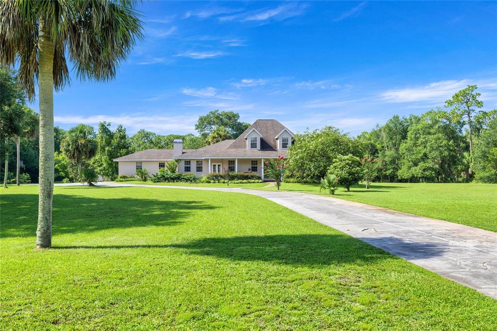 10264 West Springtree Lane Crystal River, FL 34428 - Photo 86 of 87 a view of a house with a big yard