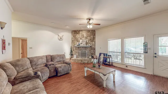 a living room with furniture and a flat screen tv