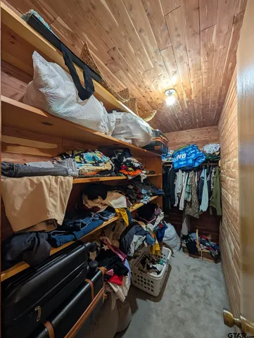 a bathroom with a sink vanity mirror and toilet