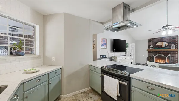 a kitchen with a stove and a microwave