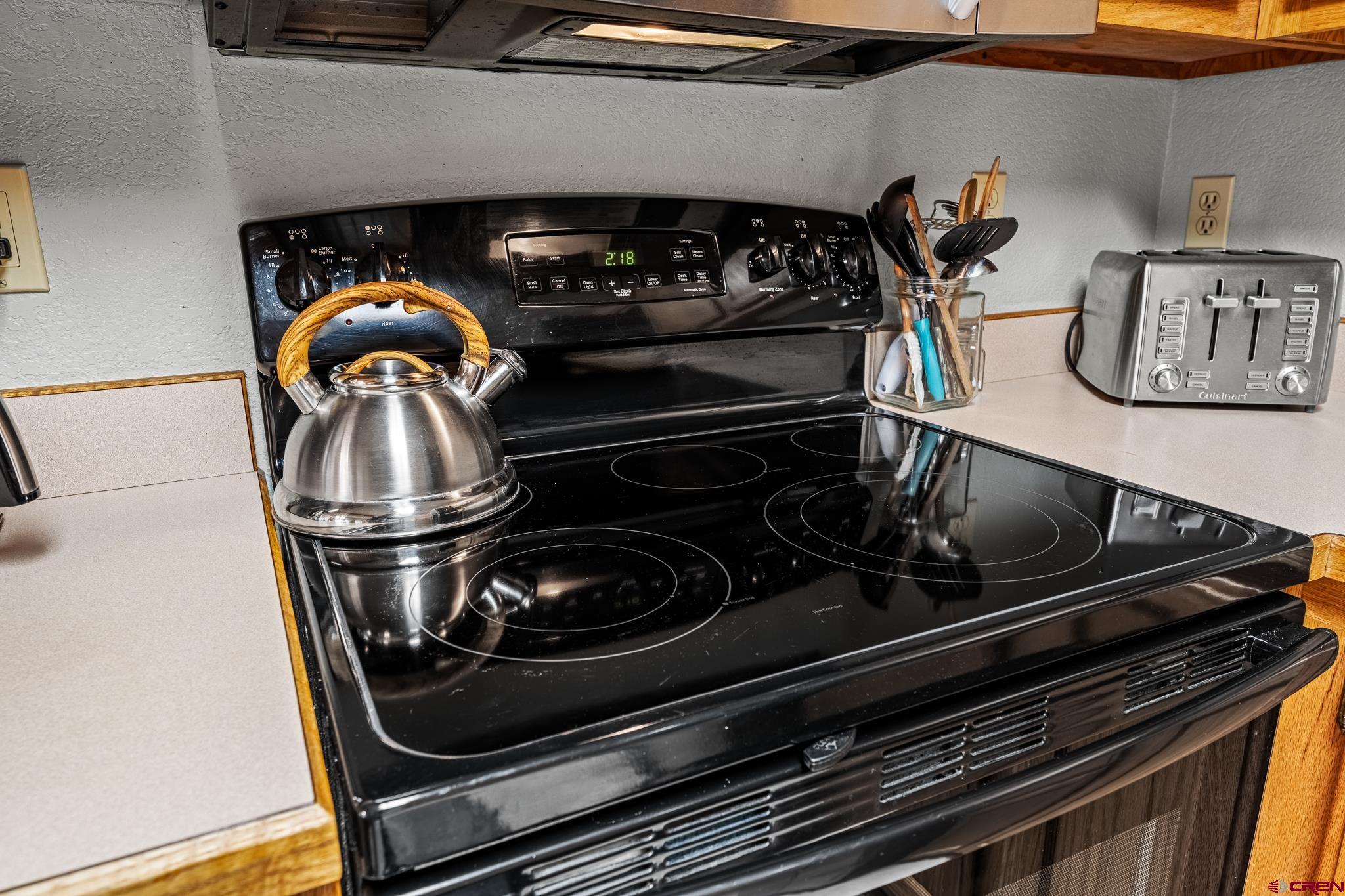 780 Waterfall Lane Durango, CO 81301 - Photo 12 of 35 a stove top oven sitting inside of a kitchen