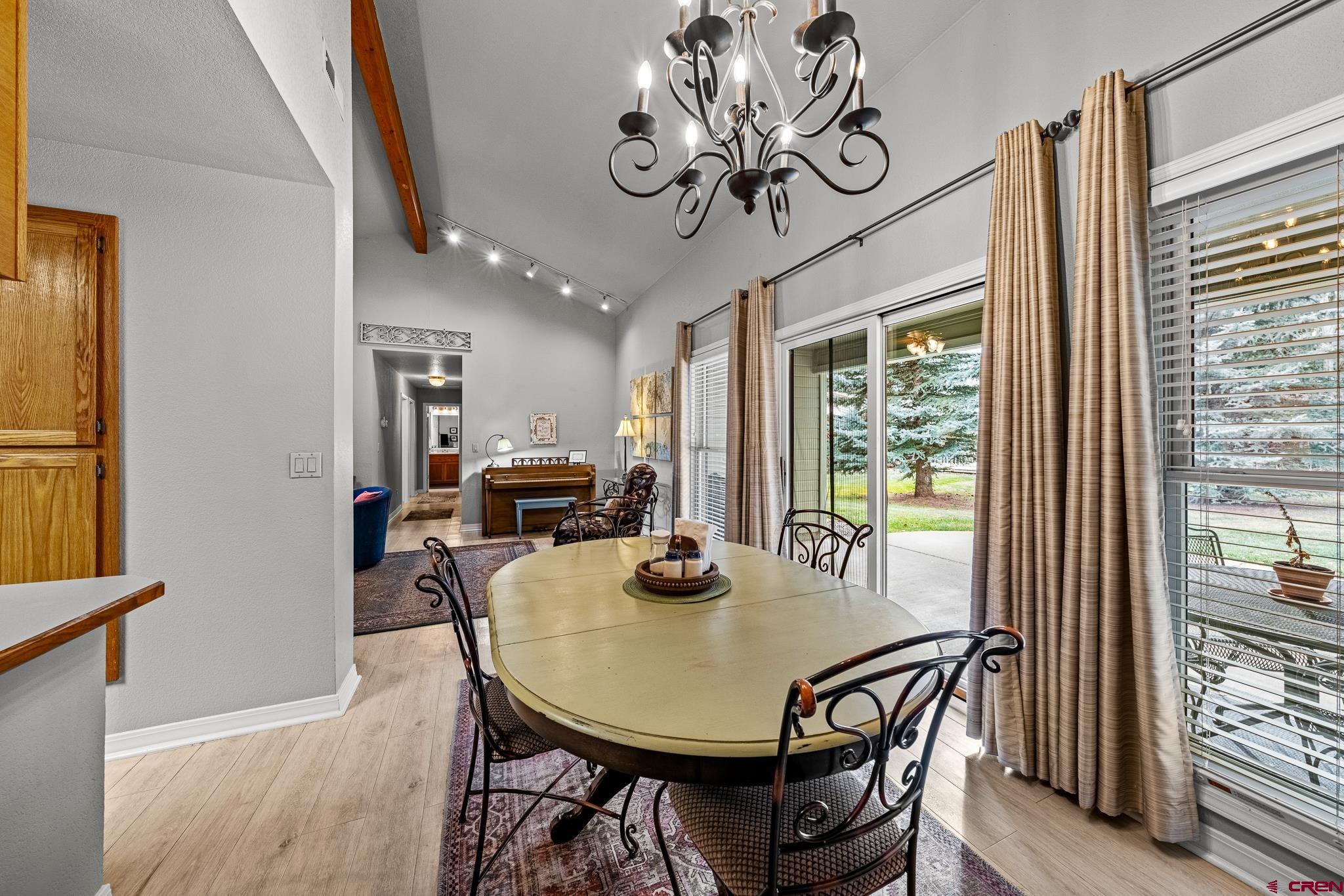 780 Waterfall Lane Durango, CO 81301 - Photo 3 of 35 a view of a dining room with furniture window and wooden floor