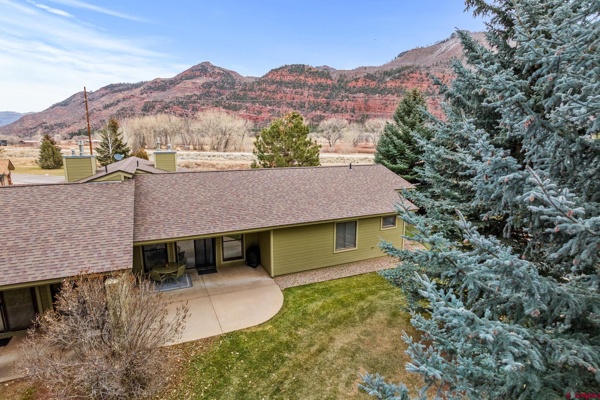 780 Waterfall Lane Durango, CO 81301 - Photo 33 of 35 a aerial view of a house with a yard and mountain view