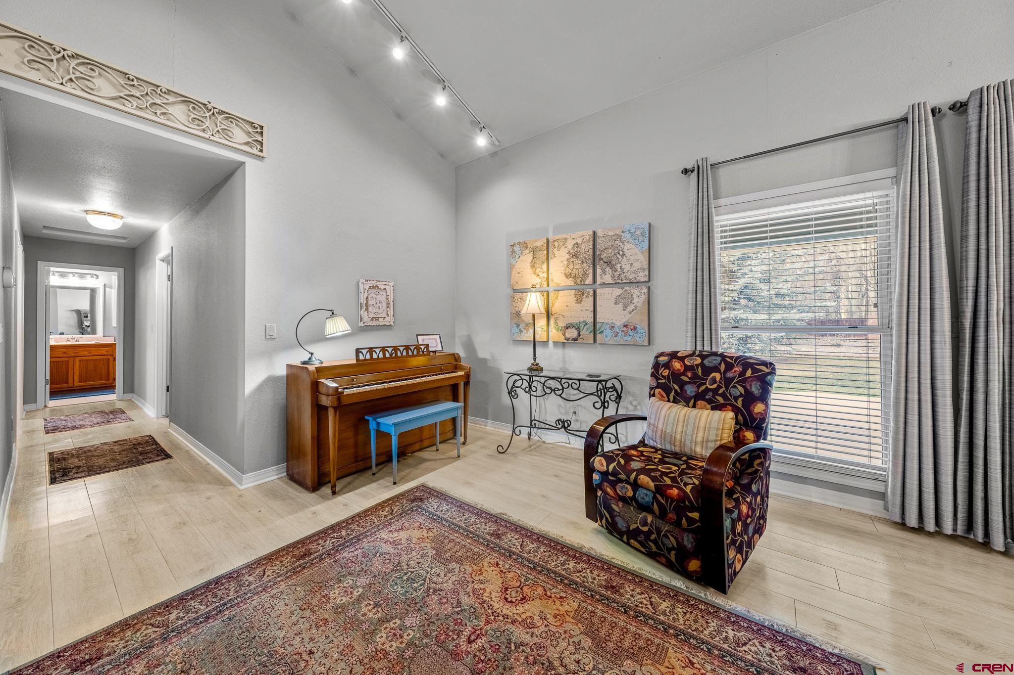 780 Waterfall Lane Durango, CO 81301 - Photo 5 of 35 a bedroom with furniture and a window