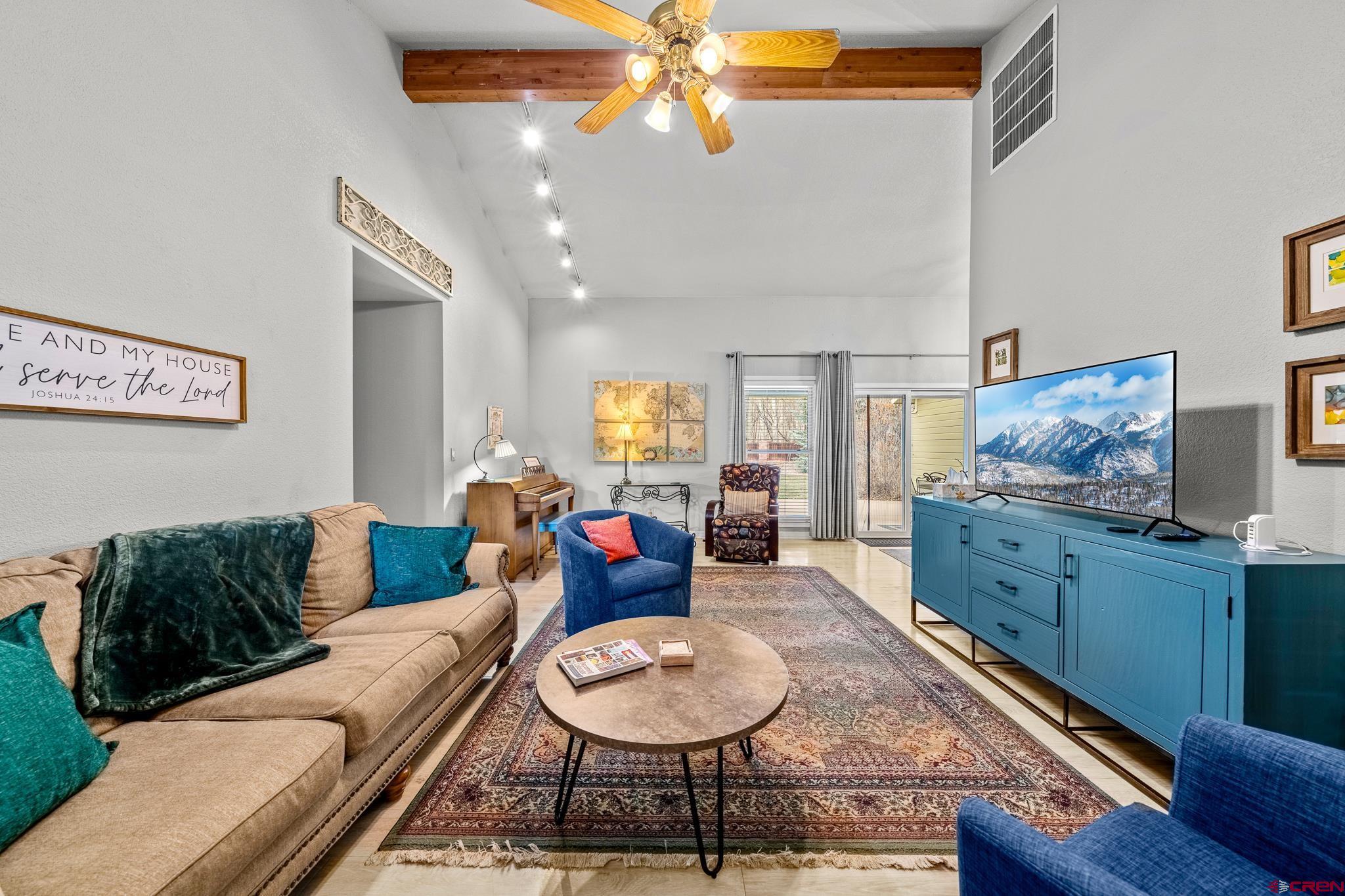 780 Waterfall Lane Durango, CO 81301 - Photo 8 of 35 a living room with furniture and a wooden floor