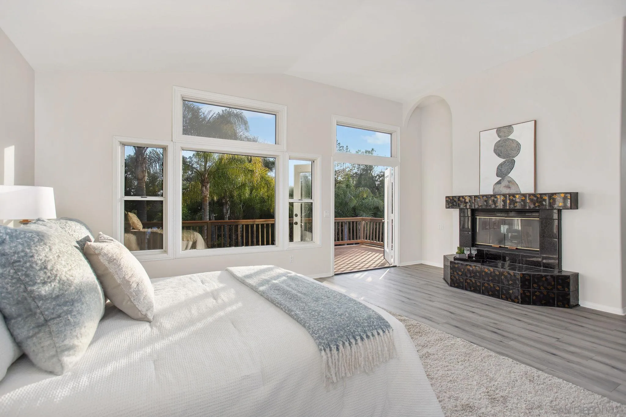 1623 Dewitt Estates Road Alpine, CA 91901 - Photo 32 of 53 a bedroom with a bed and a fireplace