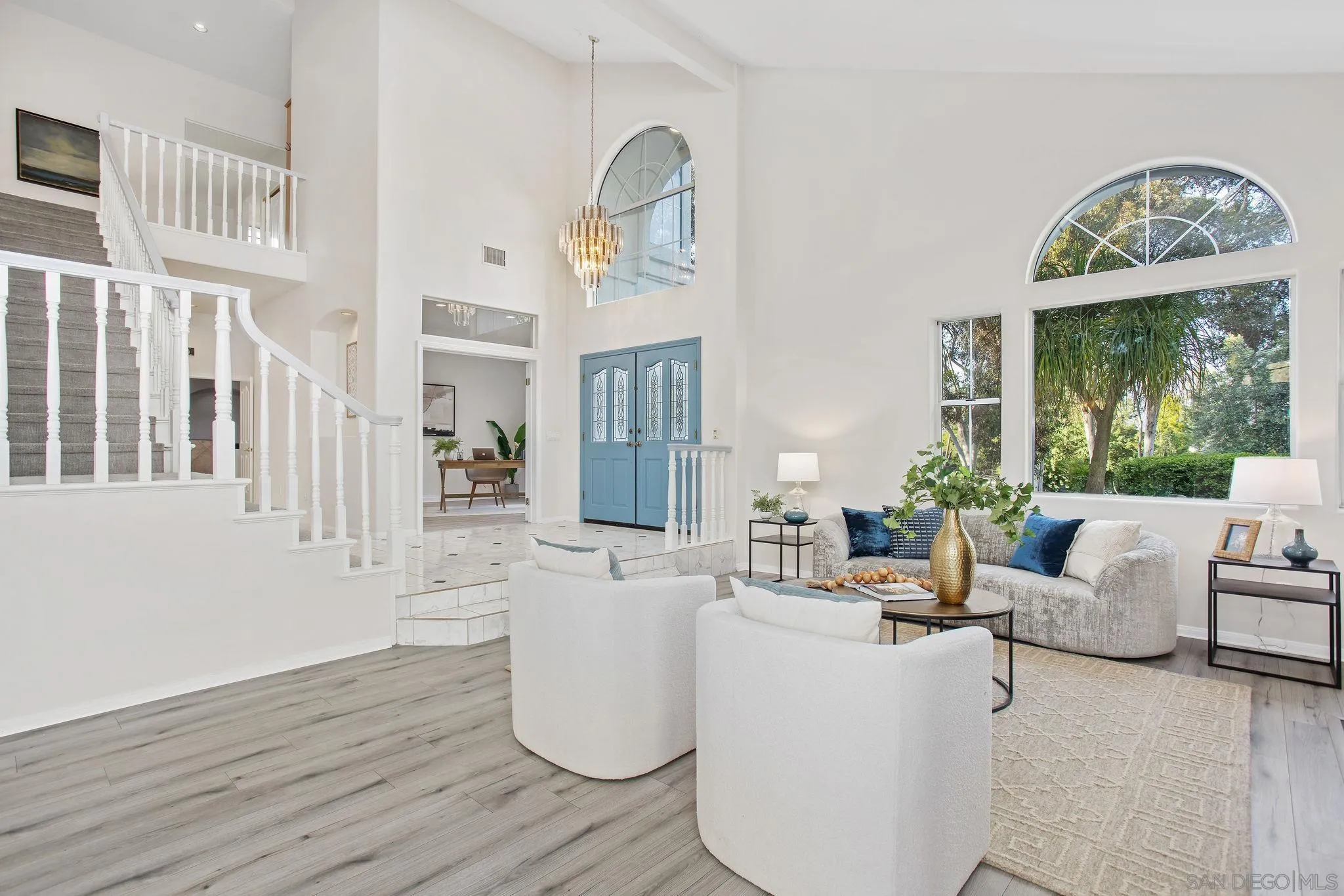 1623 Dewitt Estates Road Alpine, CA 91901 - Photo 8 of 53 a living room with furniture a fireplace and a chandelier