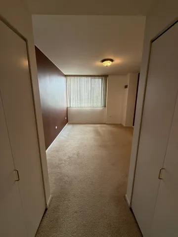 a view of an empty room with a window