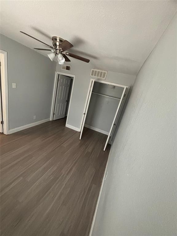 301 Rolston Road, Unit 315101 Irving, TX 75060 - Photo 3 of 12 Room featuring wood-finish flooring, light gray wall paint, and white baseboards
