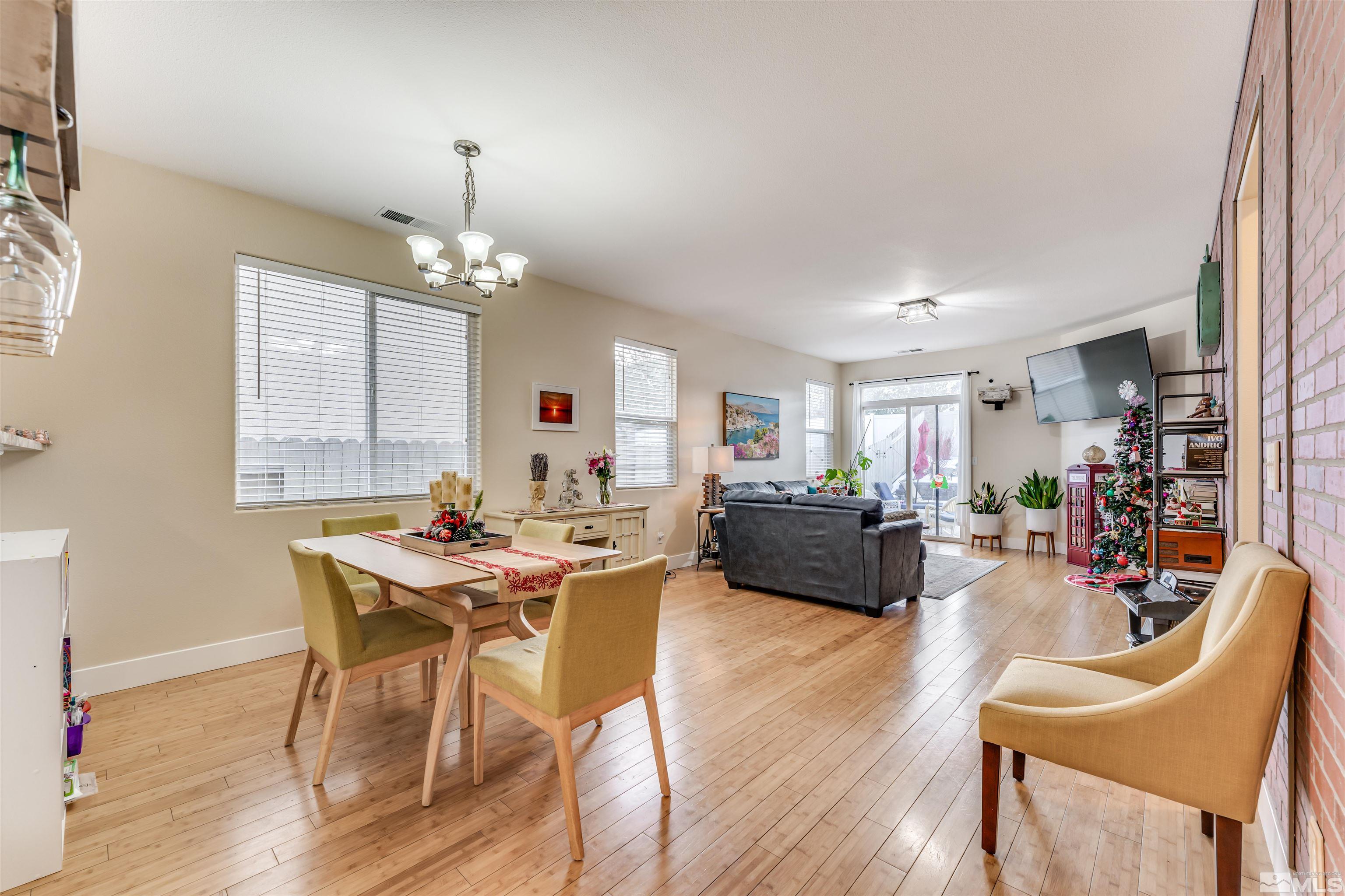 2390 Clementine Lane Reno, NV 89521 - Photo 3 of 26 a view of a dining room with furniture window and wooden floor