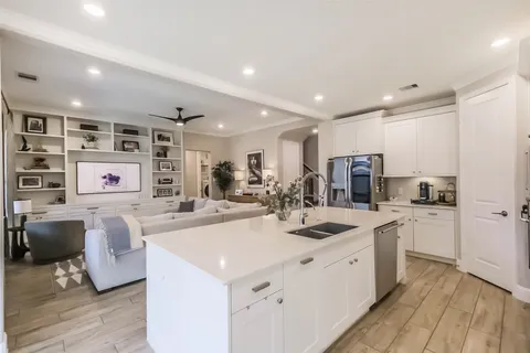a kitchen with a stove and a refrigerator