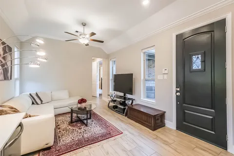 a kitchen with a refrigerator sink and cabinets
