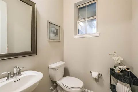 a utility room with sink dryer and washer