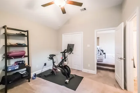 a living room with furniture a rug and a chandelier