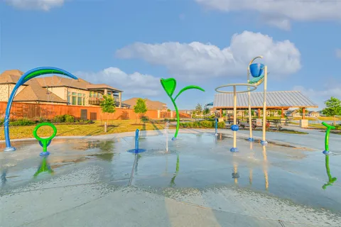 a view of a swimming pool with chairs