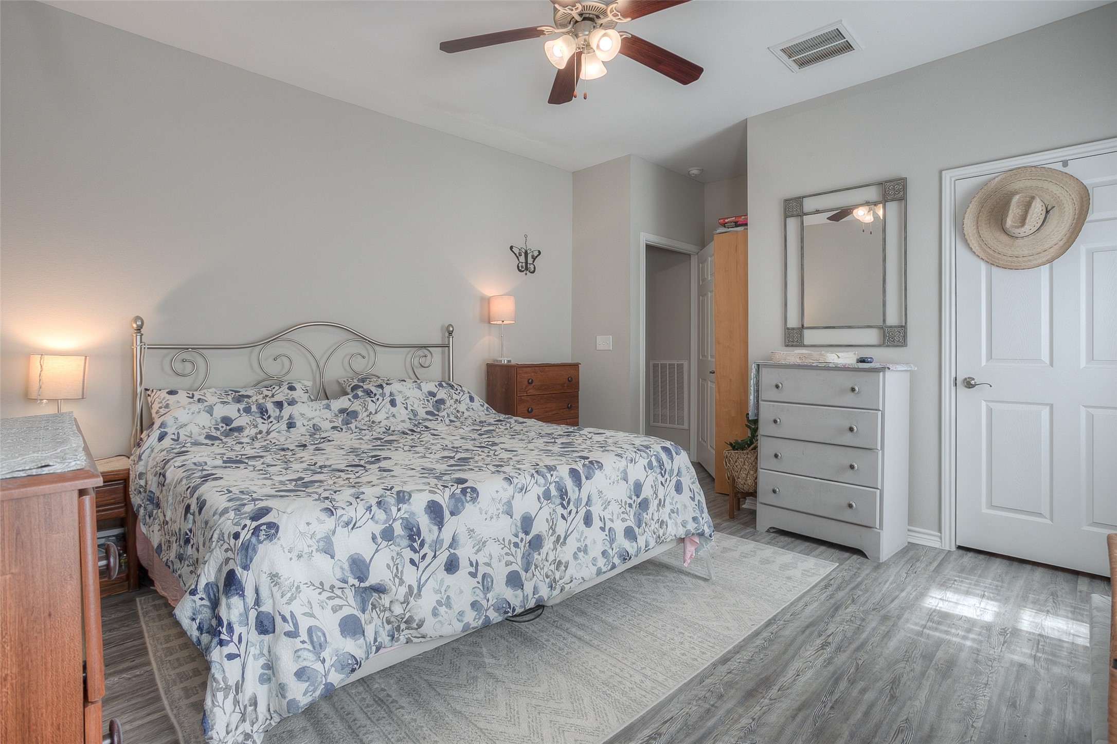 18 A R Kirk Road Trinity, TX 75862 - Photo 18 of 44 a bedroom with a large bed and a chandelier