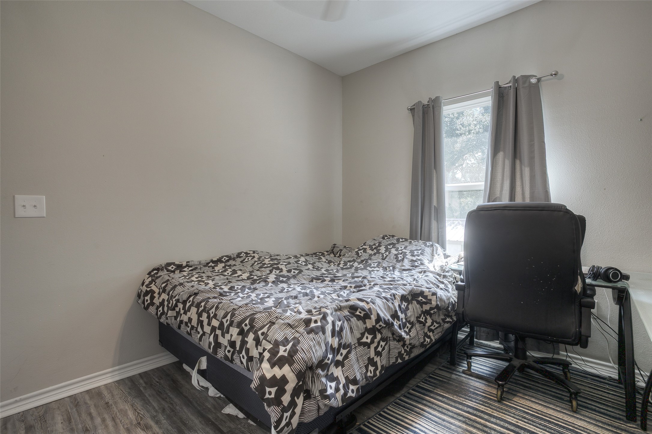 18 A R Kirk Road Trinity, TX 75862 - Photo 31 of 44 a bedroom with a bed chair and window