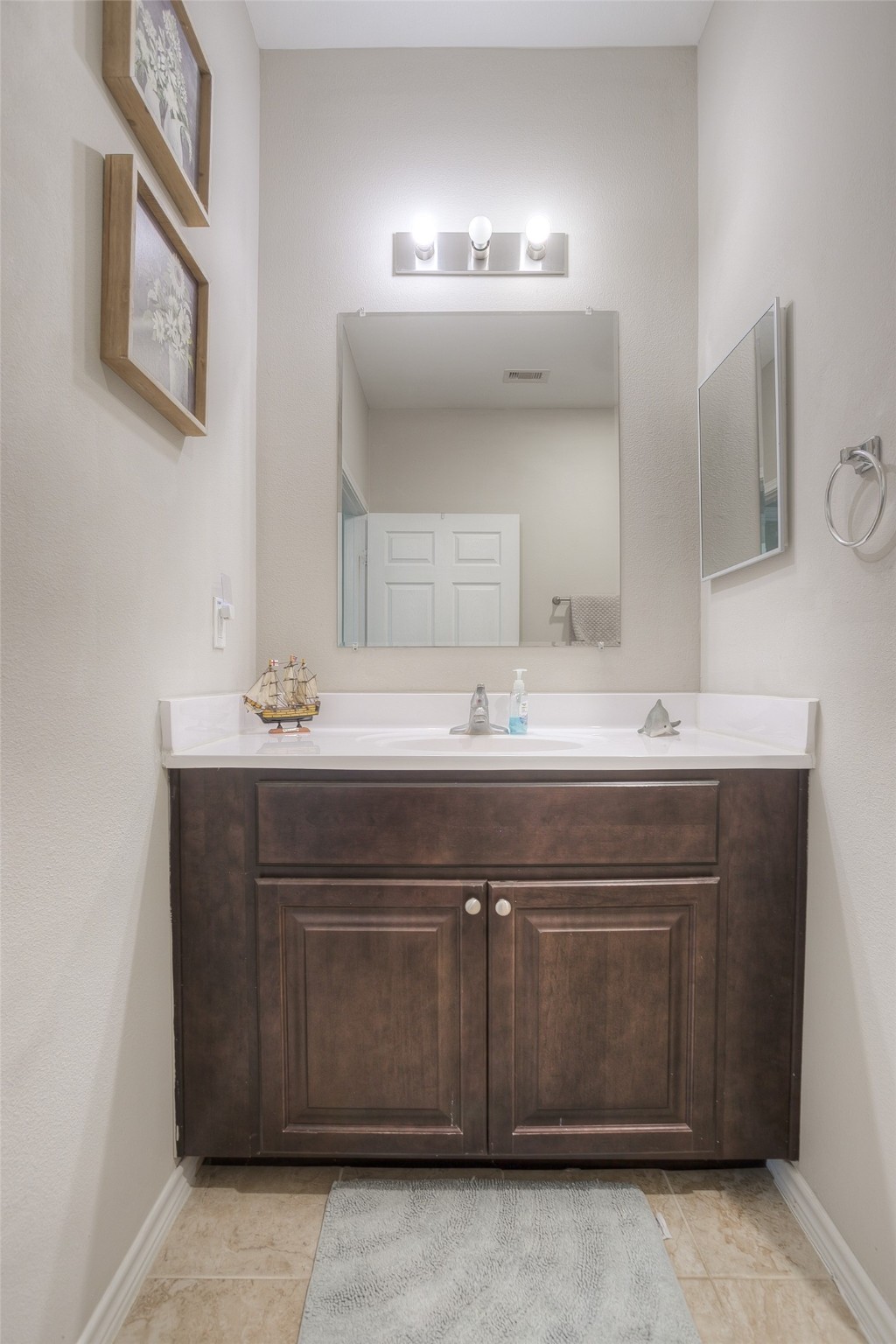 18 A R Kirk Road Trinity, TX 75862 - Photo 34 of 44 a bathroom with a sink vanity and mirror