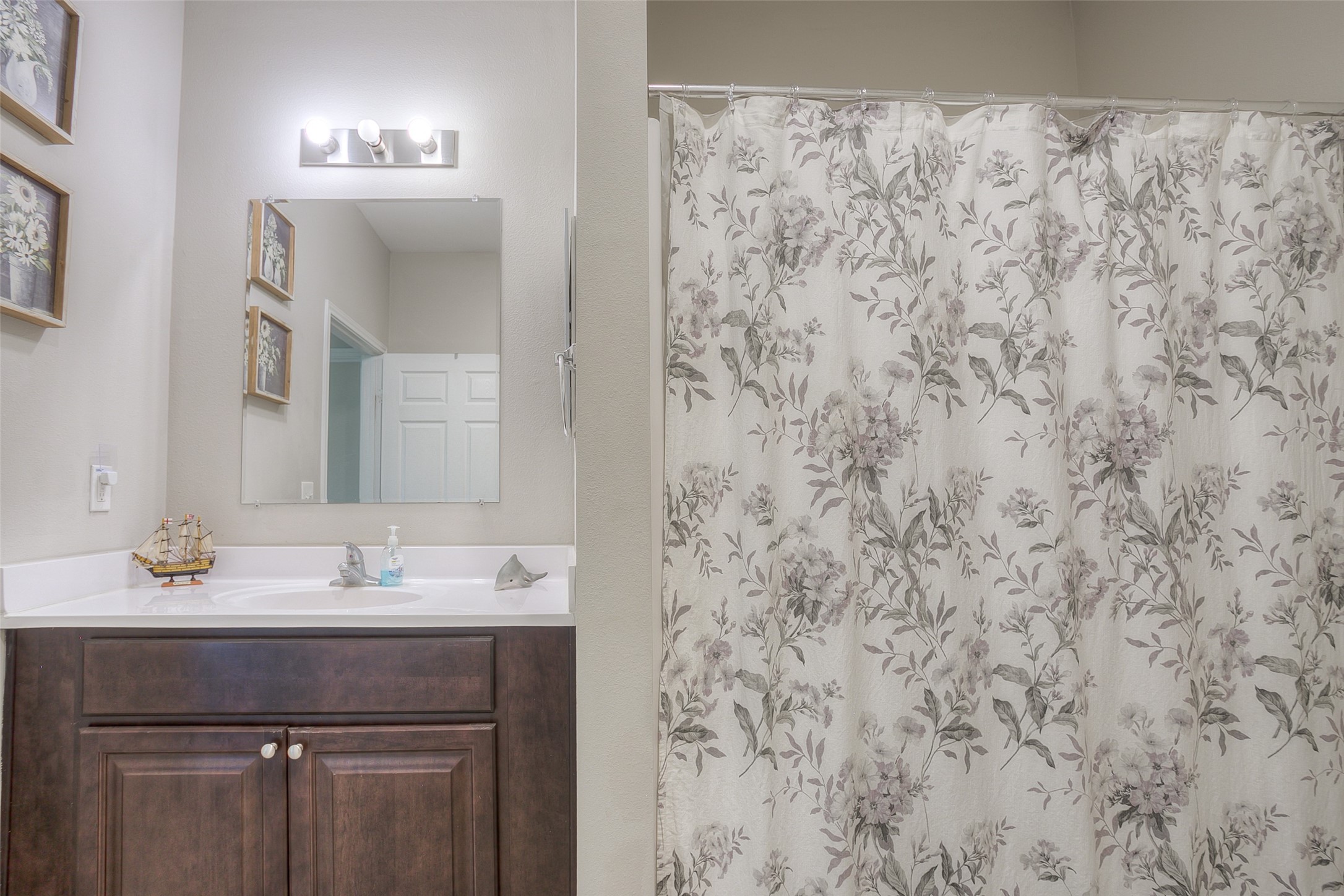 18 A R Kirk Road Trinity, TX 75862 - Photo 34 of 44 a bathroom with a sink and a mirror
