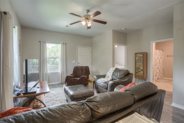 a living room with furniture and a large window