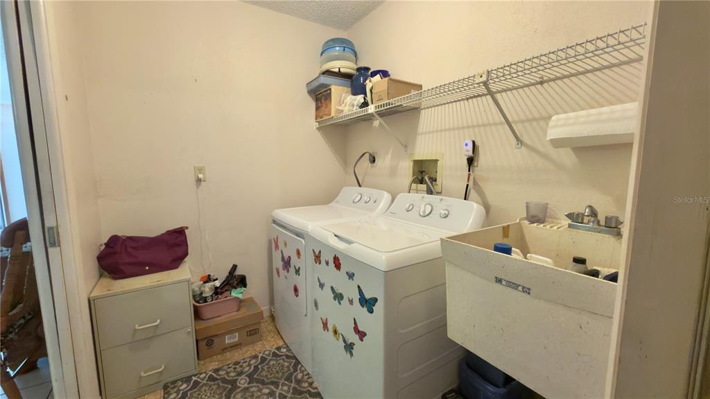 12985 116th Street Largo, FL 33778 - Photo 18 of 28 a utility room with dryer and washer
