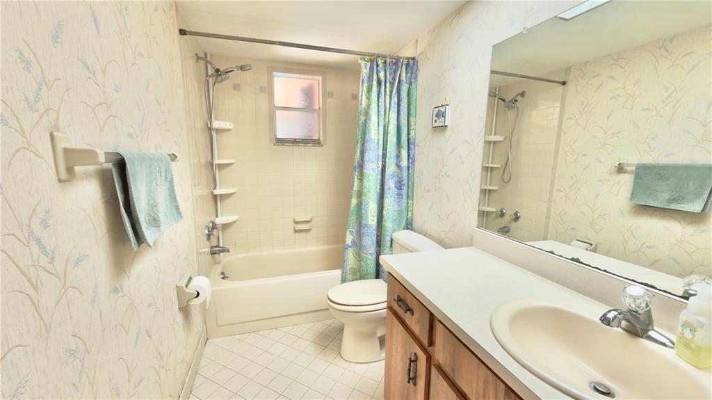 12985 116th Street Largo, FL 33778 - Photo 9 of 28 a bathroom with a sink toilet and shower