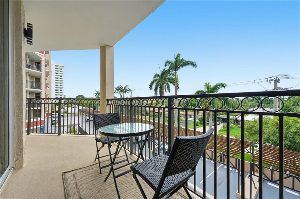 2011 North Ocean Boulevard, Unit 302 Fort Lauderdale, FL 33305 - Photo 17 of 45 a view of a balcony with furniture