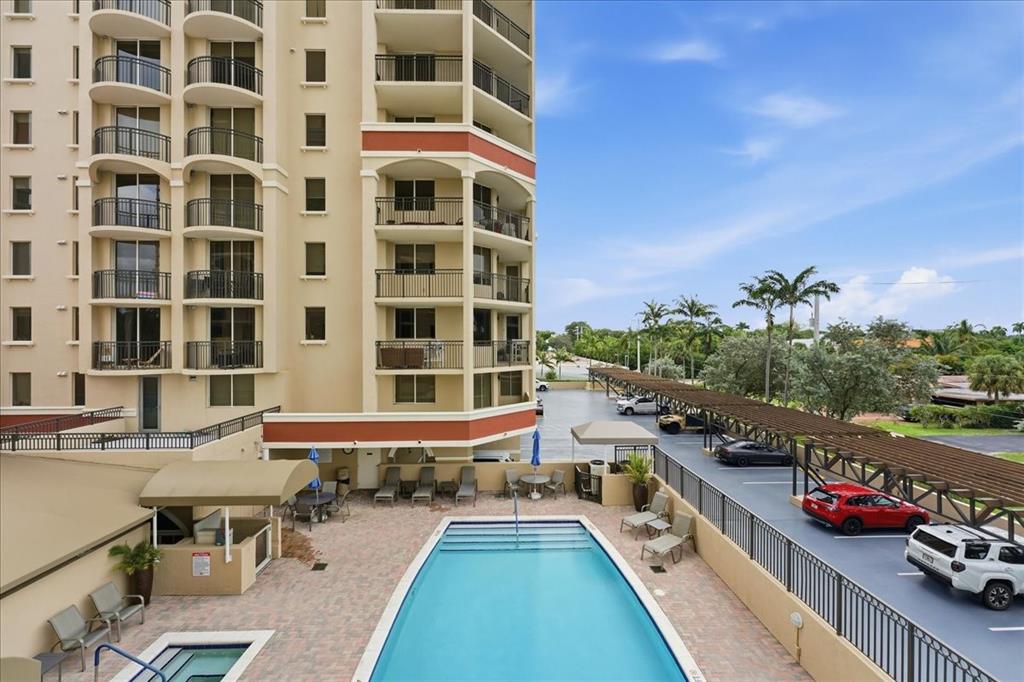 2011 North Ocean Boulevard, Unit 302 Fort Lauderdale, FL 33305 - Photo 19 of 45 a view of a balcony with chairs and a potted plant