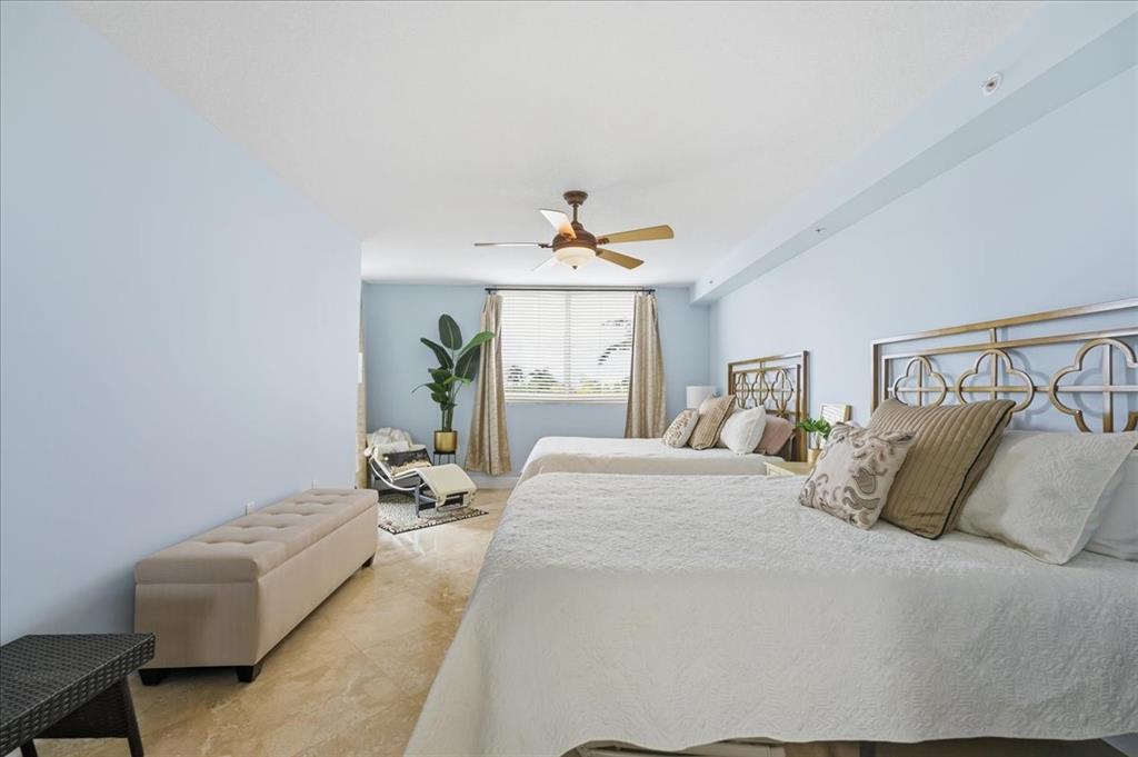 2011 North Ocean Boulevard, Unit 302 Fort Lauderdale, FL 33305 - Photo 20 of 45 a bedroom with a bed and window