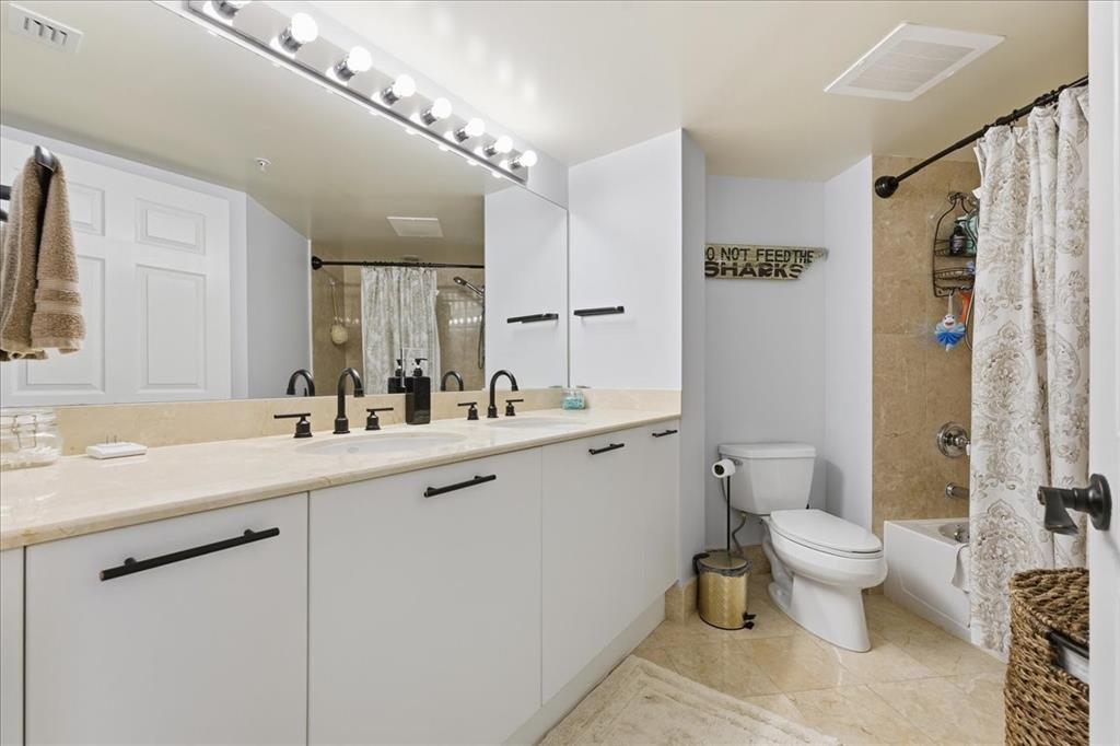 2011 North Ocean Boulevard, Unit 302 Fort Lauderdale, FL 33305 - Photo 25 of 45 a bathroom with a sink toilet and shower