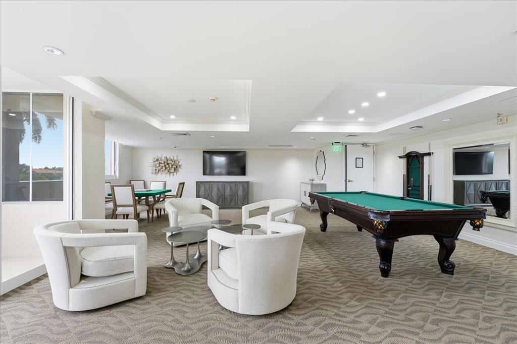 2011 North Ocean Boulevard, Unit 302 Fort Lauderdale, FL 33305 - Photo 27 of 45 a living room with furniture and a pool table