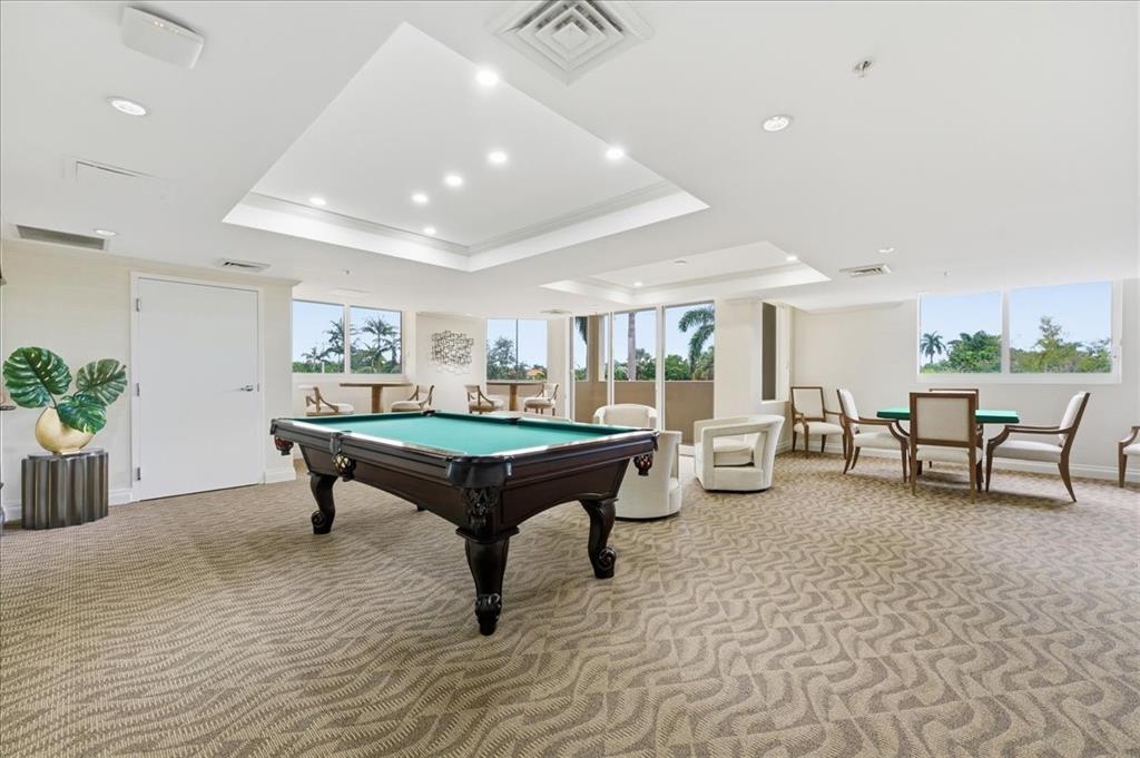 2011 North Ocean Boulevard, Unit 302 Fort Lauderdale, FL 33305 - Photo 28 of 45 a living room with furniture and a table