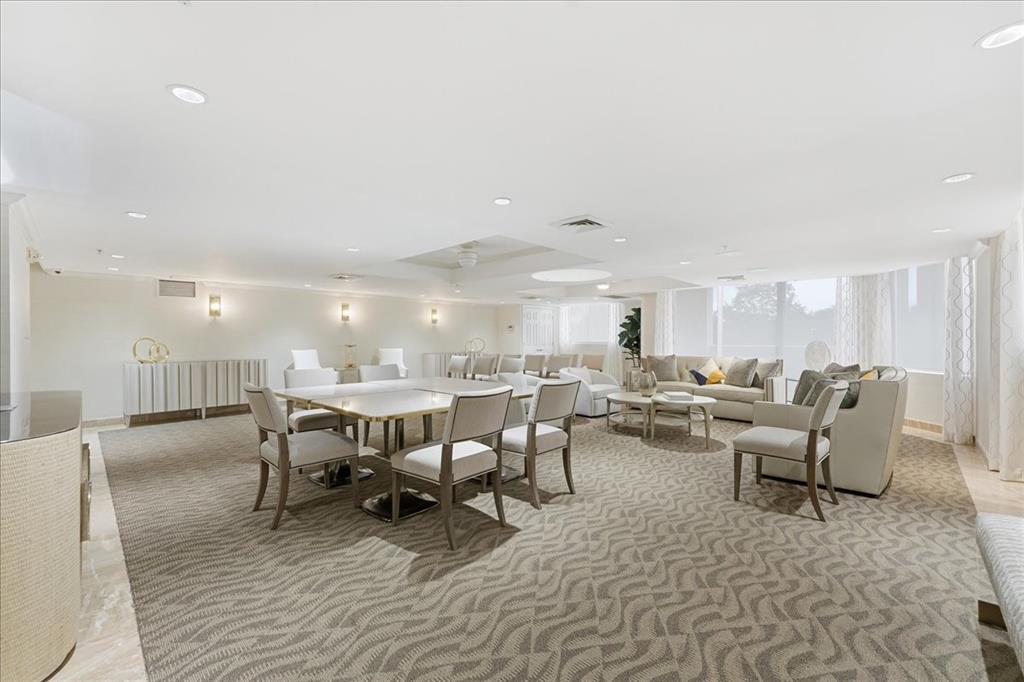 2011 North Ocean Boulevard, Unit 302 Fort Lauderdale, FL 33305 - Photo 31 of 45 a living room with lots of furniture and a wooden floor