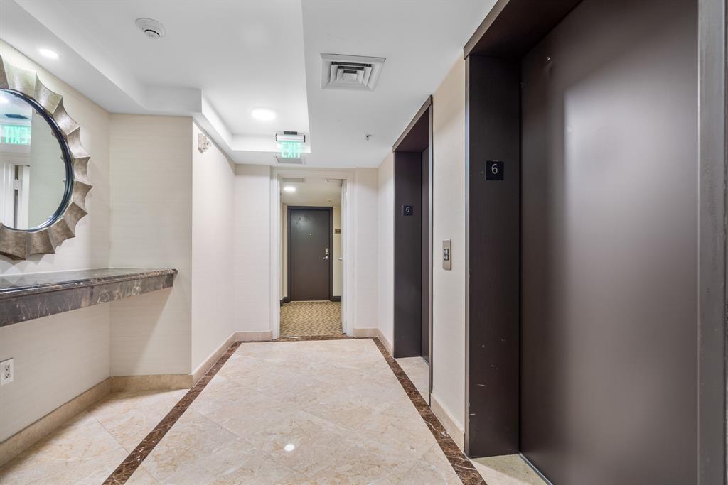 2011 North Ocean Boulevard, Unit 302 Fort Lauderdale, FL 33305 - Photo 8 of 45 a view of a hallway with wooden floor and staircase