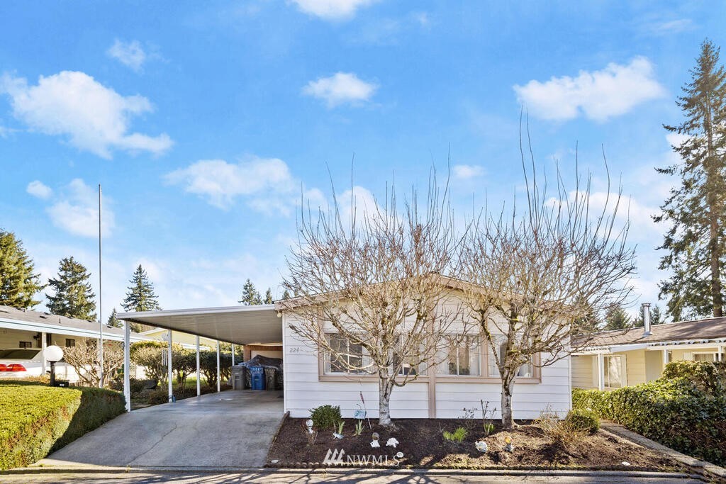 201 Union Avenue Southeast, Unit 224 Renton, WA 98059 - Photo 1 of 23 a front view of a building with trees